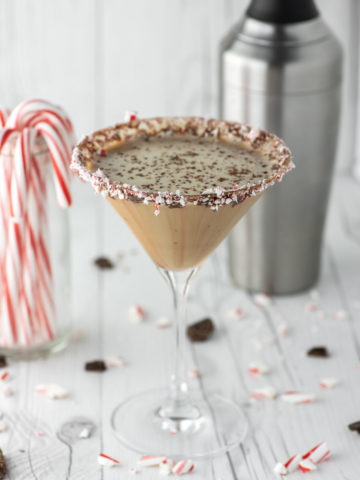 chocolate peppermint martini in glass with cocktail shaker in background