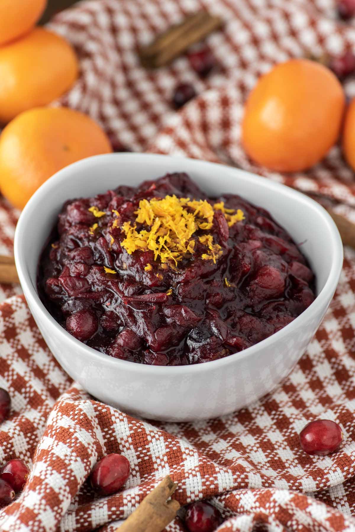 cranberry sauce in white bowl on dish towel