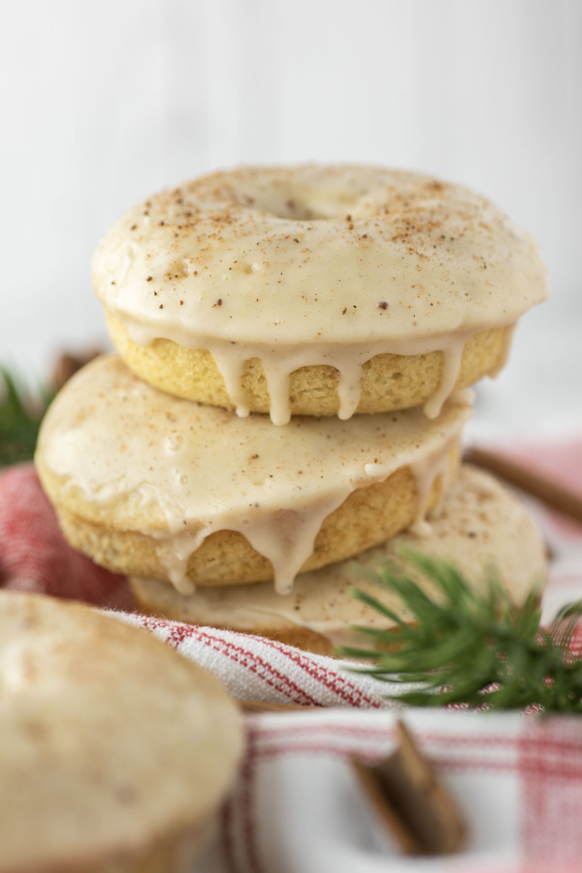 three eggnog donuts stacked