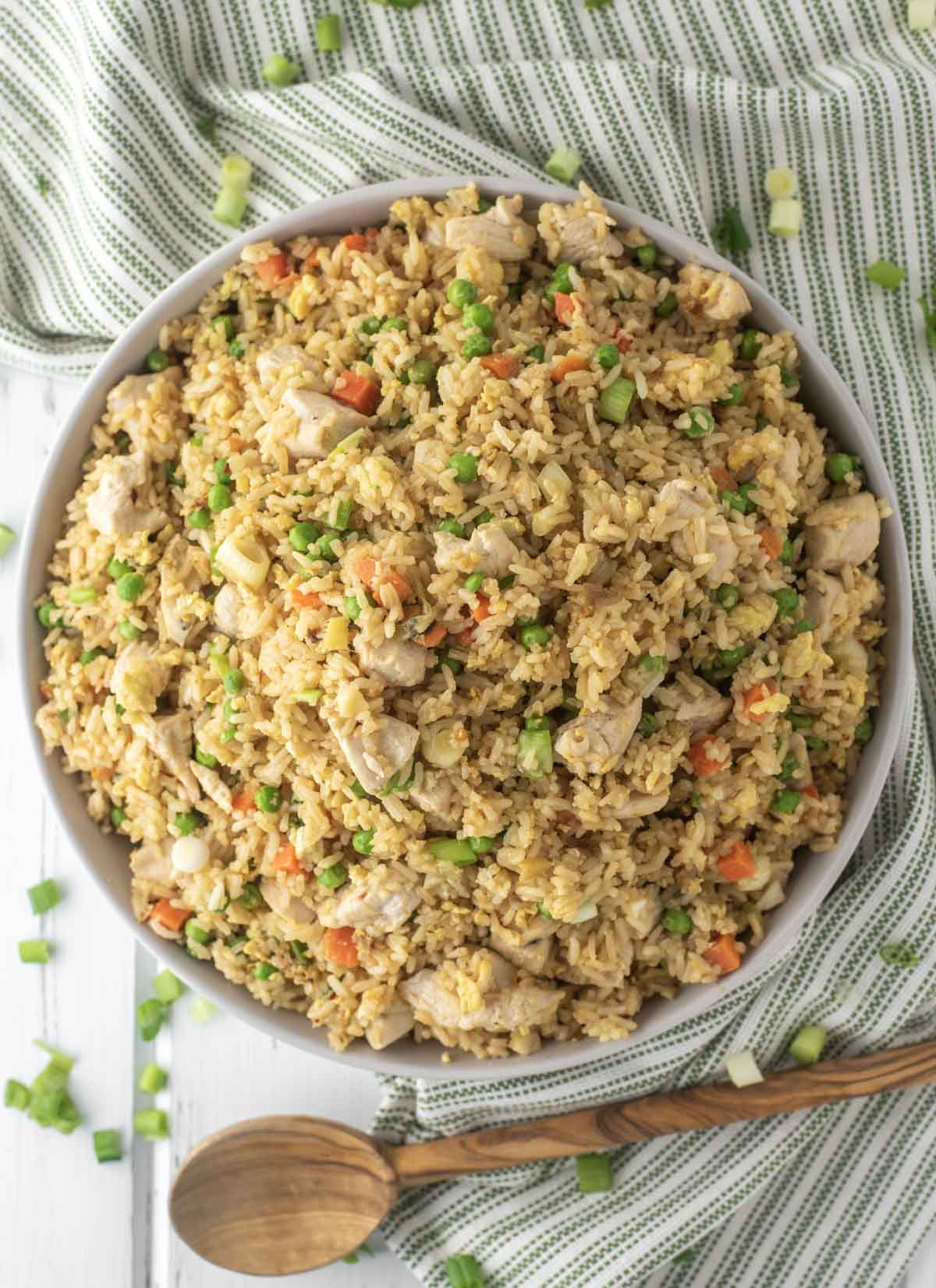 overhead shot of chicken fried rice in bowl on dish towel