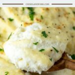 wooden spoon dipped in cream cheese mashed potatoes