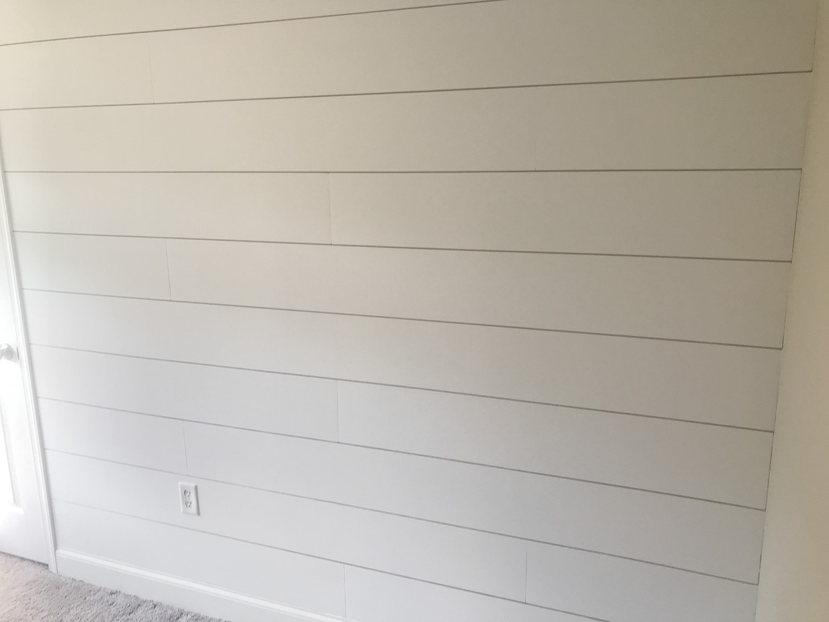prime and painting DIY shiplap