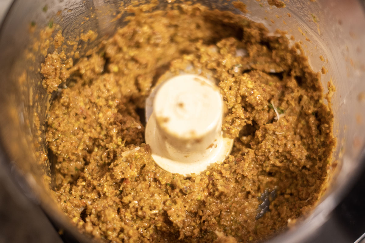 sun-dried tomato pesto being blended in food processor