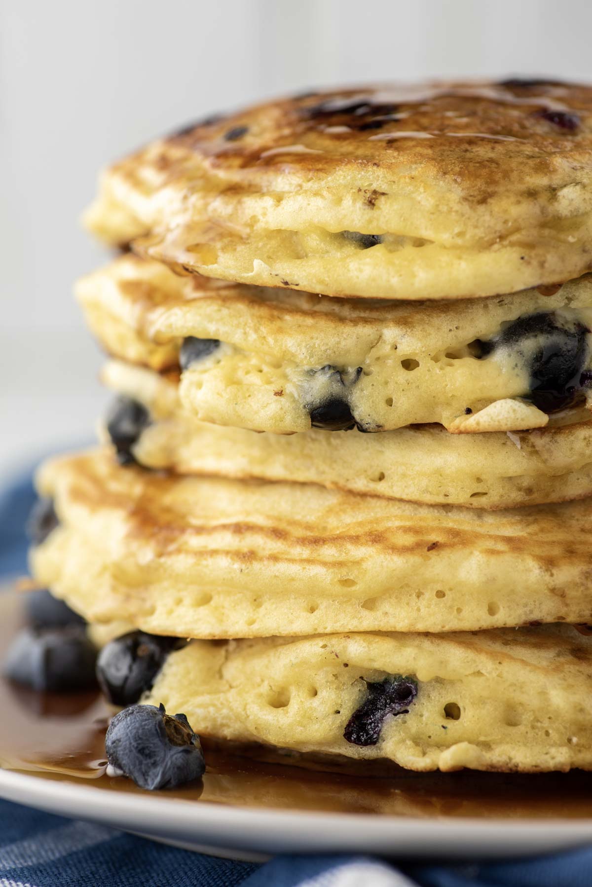 stacked blueberry pancakes on plate