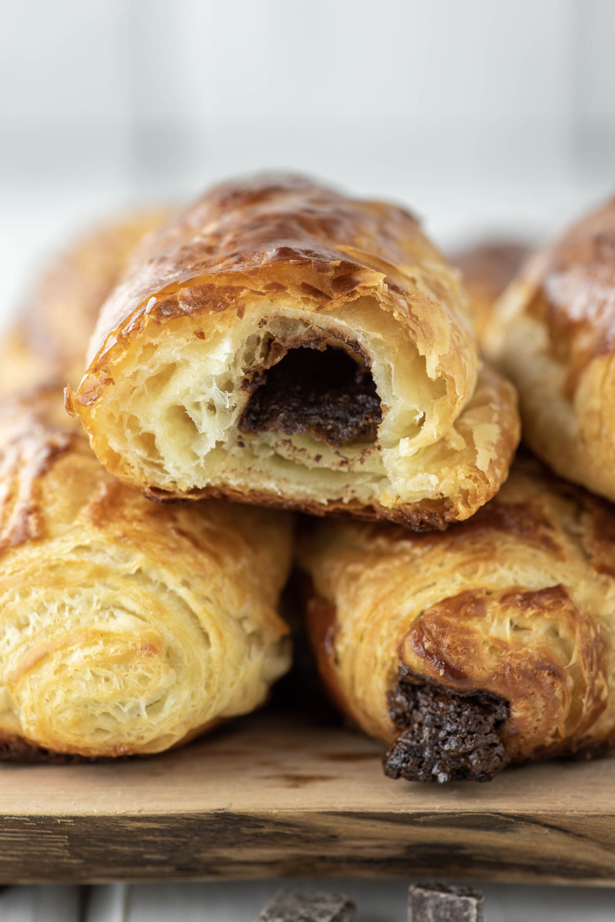 eaten chocolate croissant stacked on other croissants