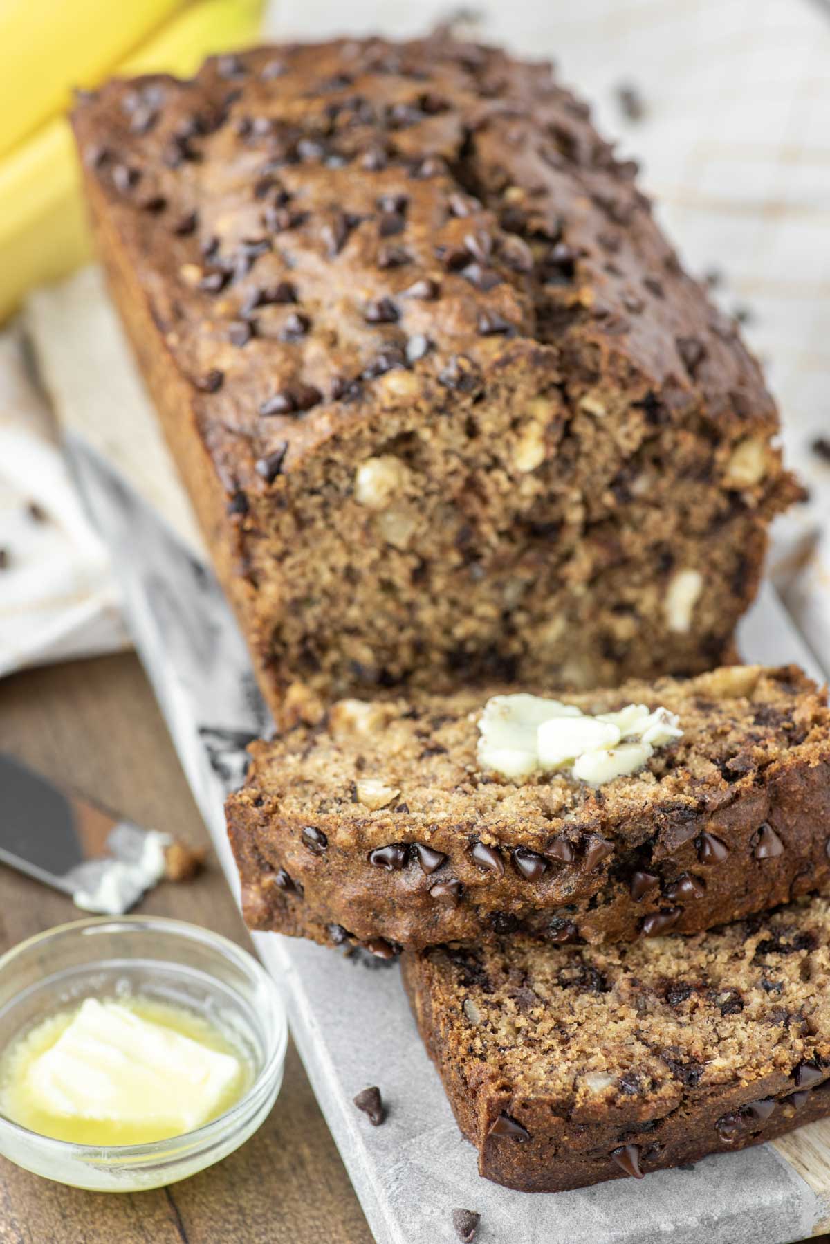 healthy banana bread sliced with butter
