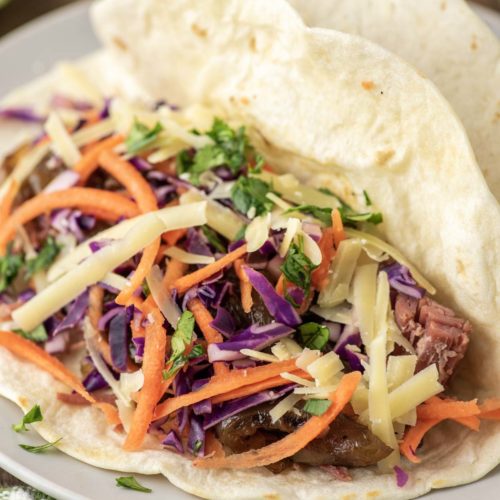 tortillas with corned beef and slaw on plate