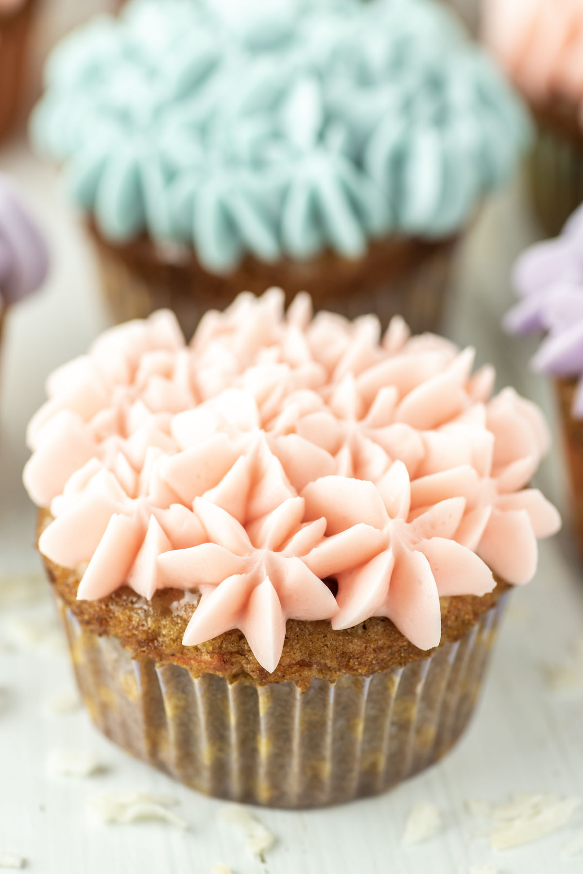 carrot cake cupcake with pink mascarpone frosting