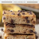 3 stacked chocolate chip banana bars on parchment paper