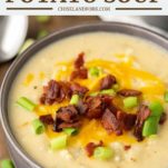loaded potato soup topped with bacon and cheese in grey bowl