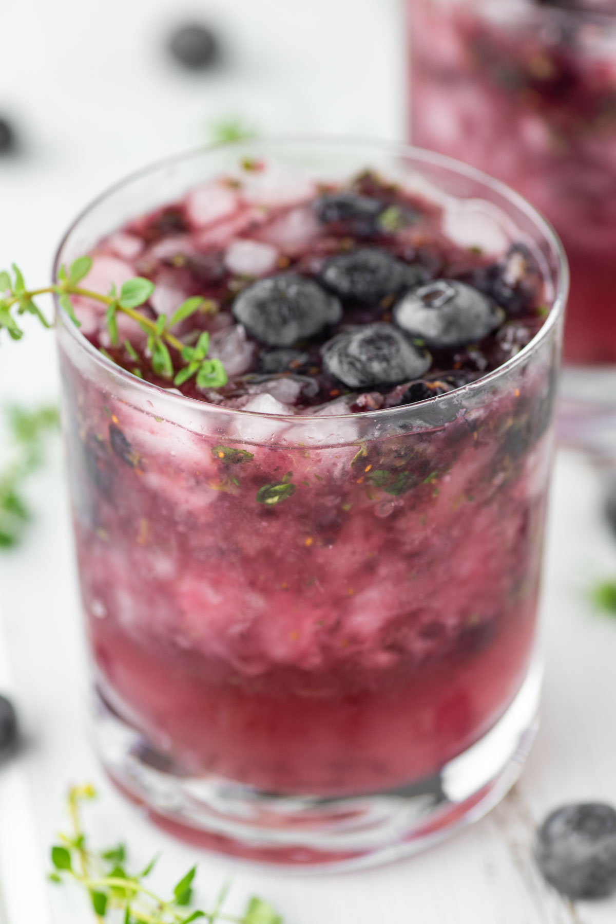blueberry smash in glass with fresh blueberries