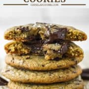 stacked brown butter chocolate chip cookies on parchment paper