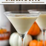 two glasses of pumpkin martini with pumpkins in the background