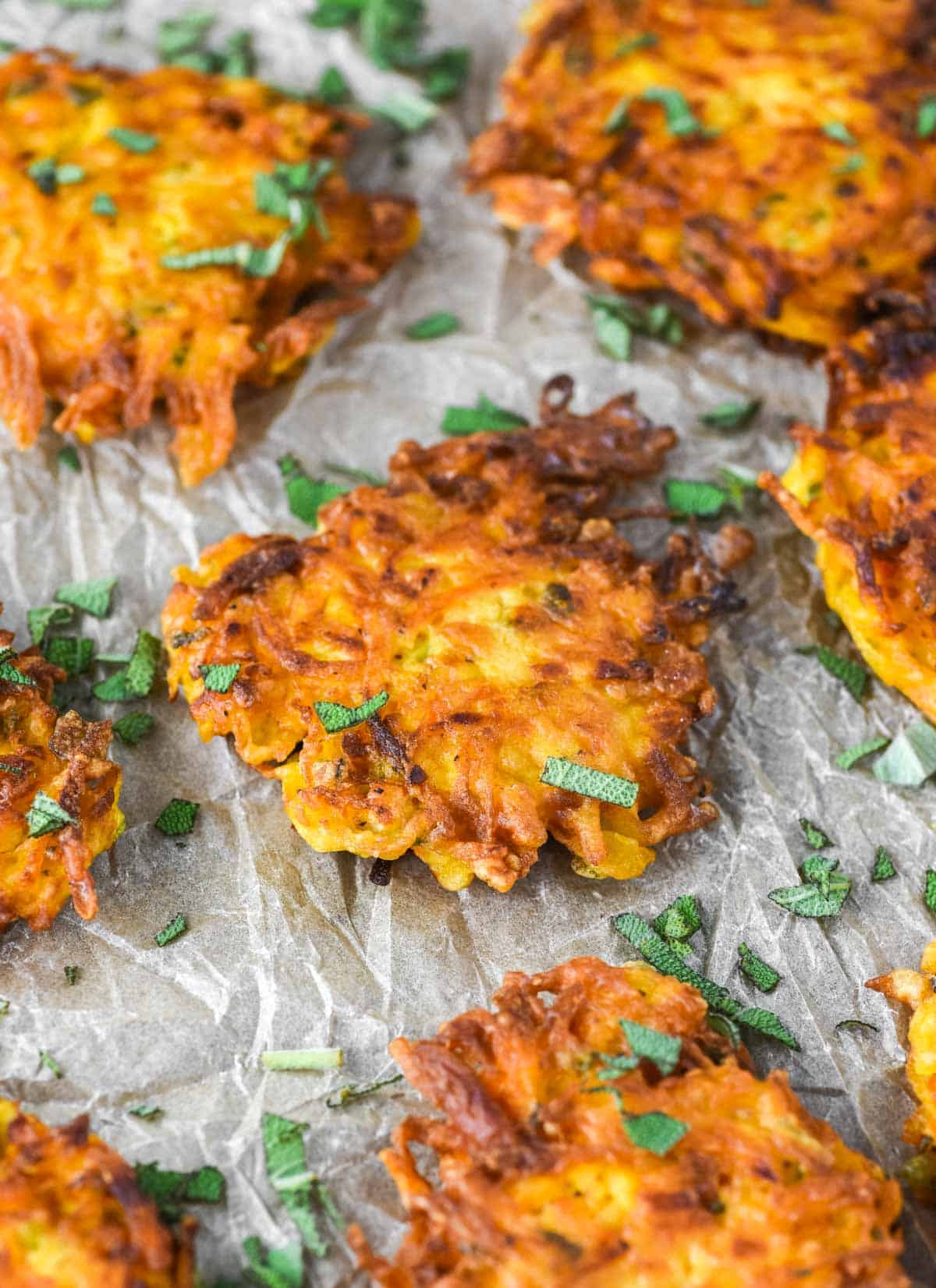 butternut squash fritters on parchment paper