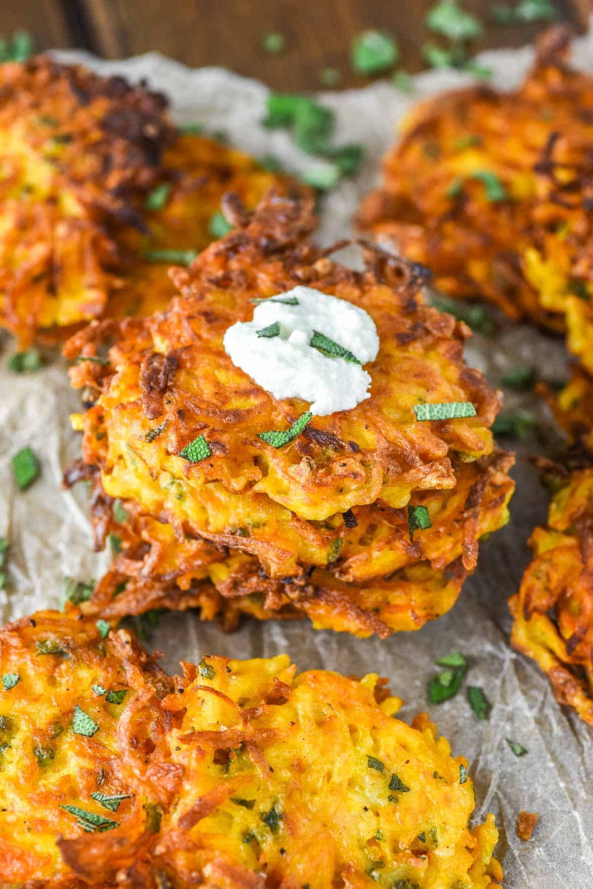 butternut squash fritters stacked with some goat cheese on top