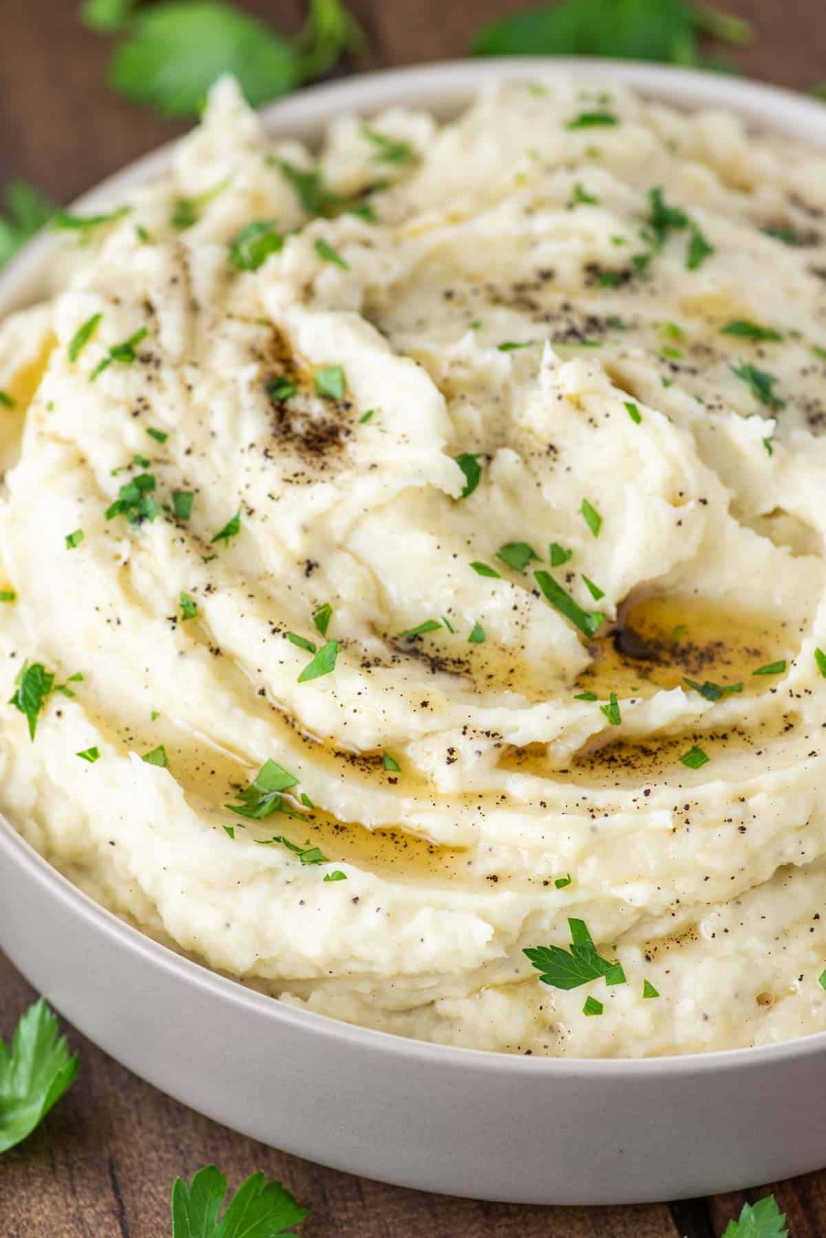 grey bowl of mashed potatoes made with brown butter
