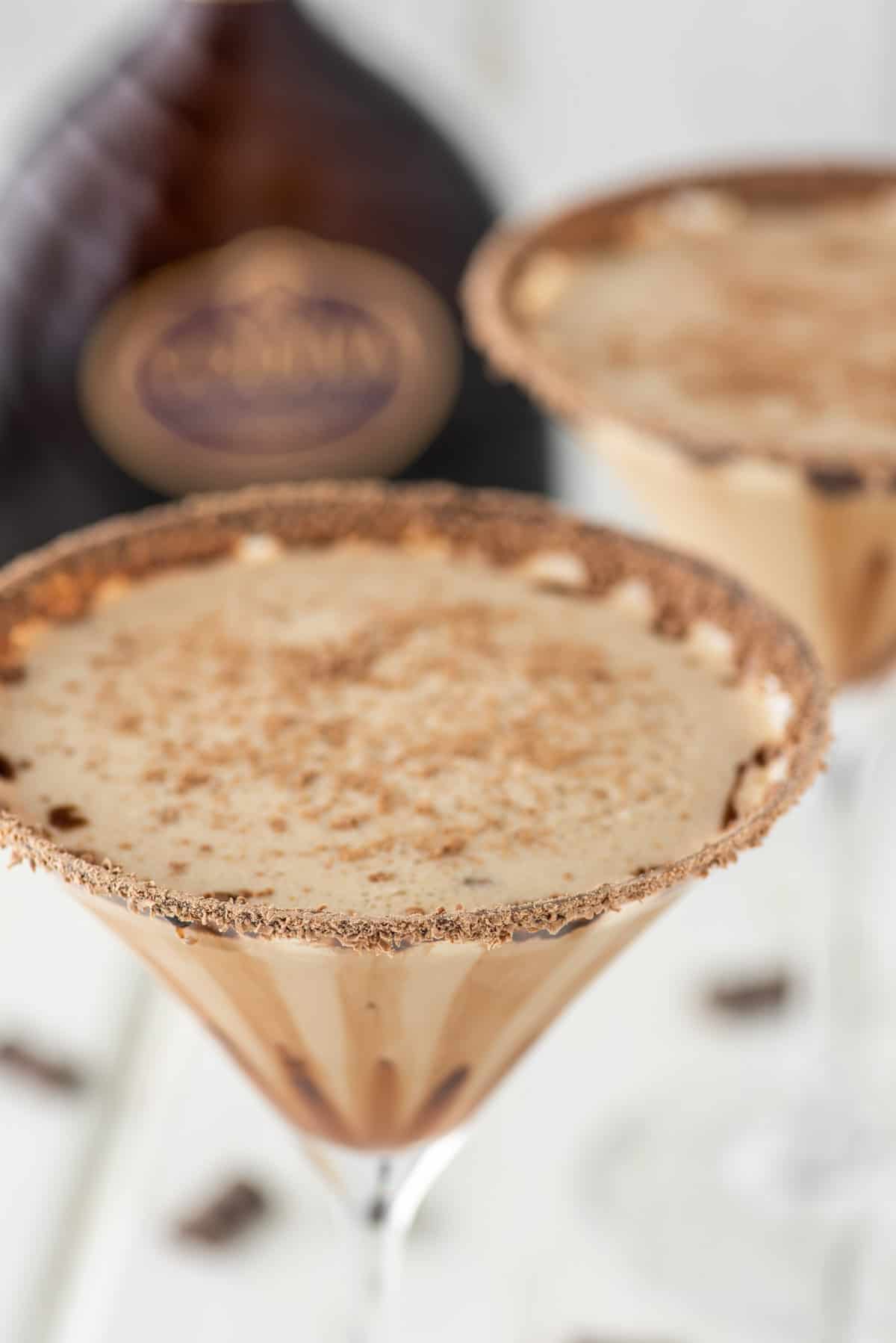 two glasses of chocolate martinis with Godiva liqueur in the background