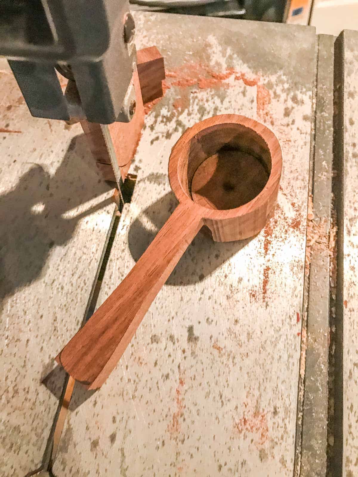 cut the sides out of the coffee scoop with band saw