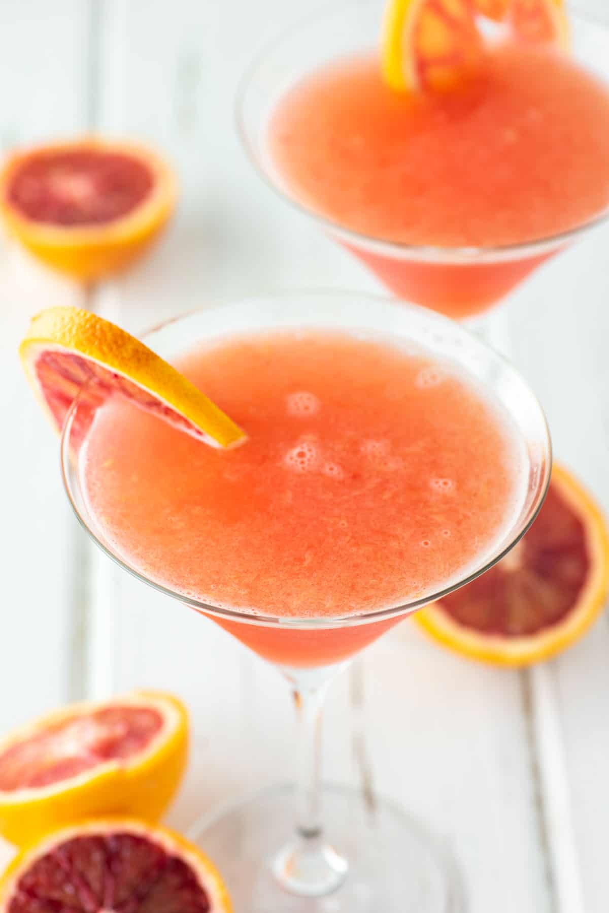 two glasses of blood orange martinis