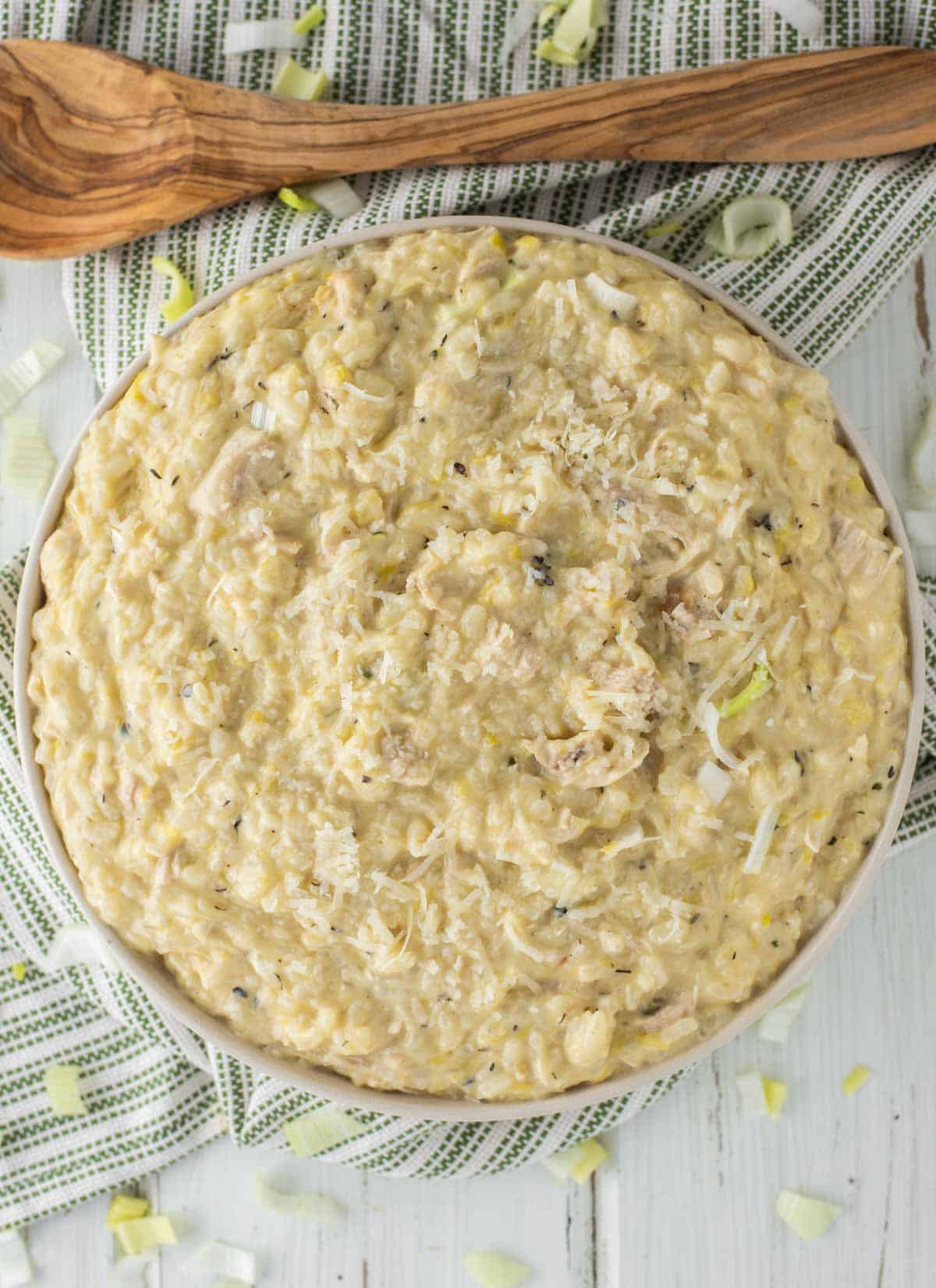 overhead shot of bowl of risotto with chicken, lemon and leeks