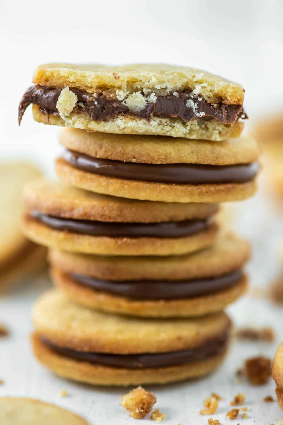 nutella biscuit bitten in half and on top of four others