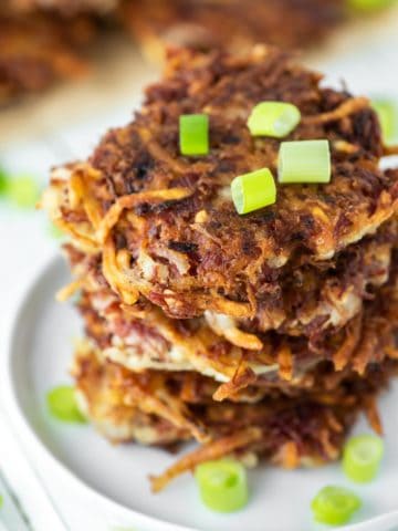 corned beef fritters stacked on white plate
