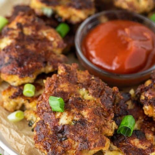 chicken fritters on plate with ketchup