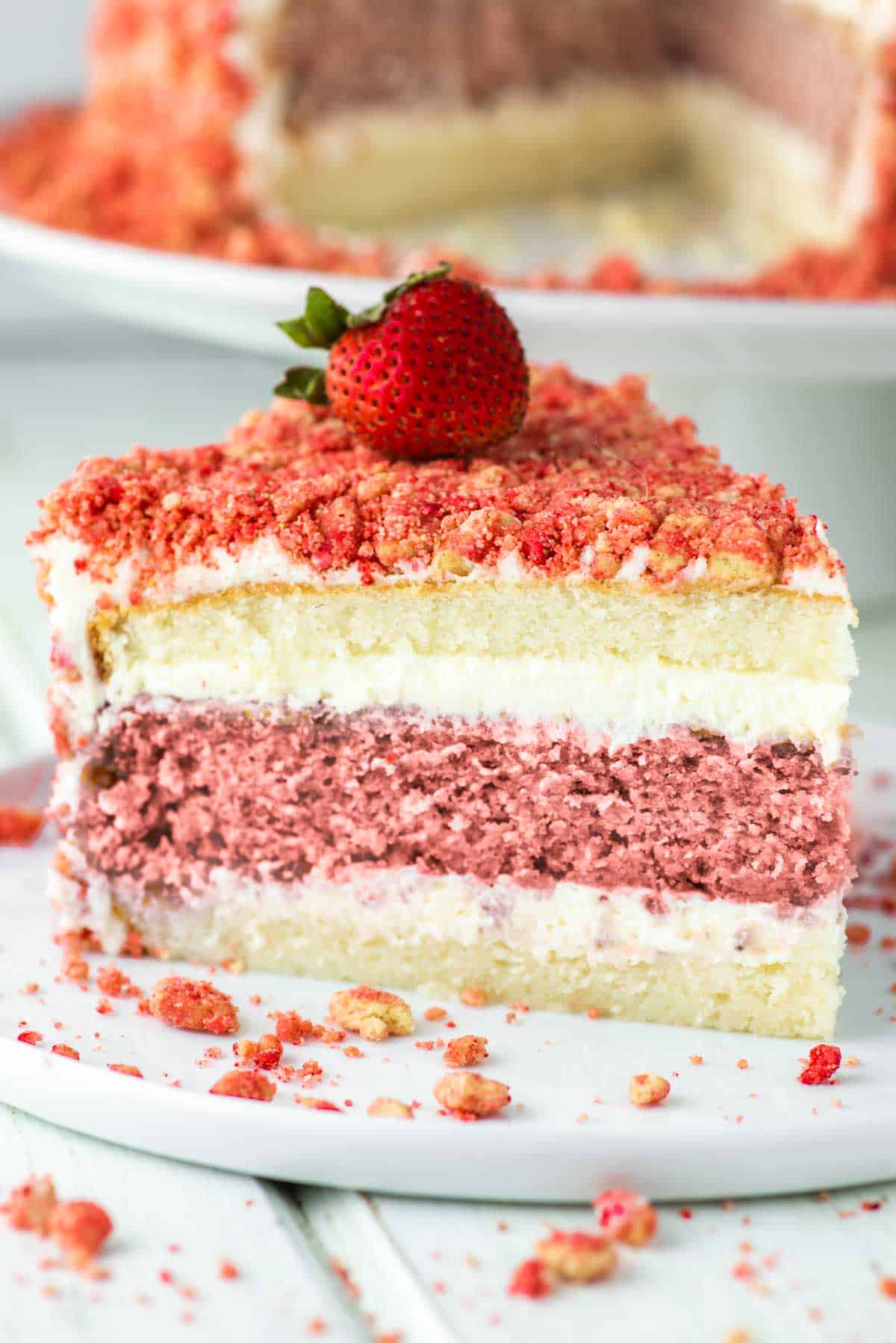 slice of strawberry crunch cake on white plate