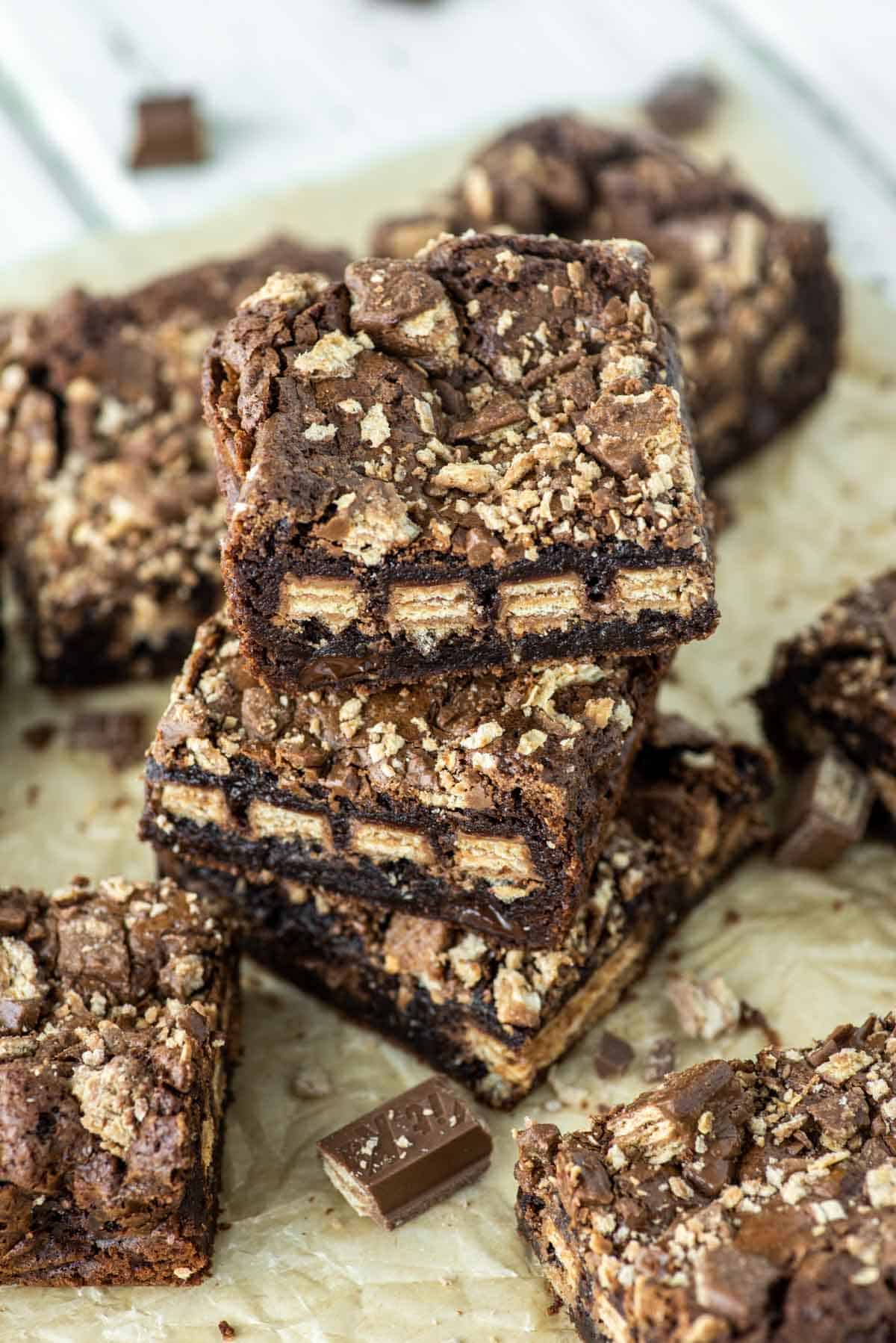 stacked Kit Kat brownies on parchment paper