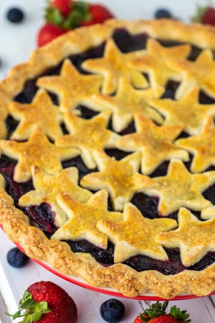 close-up with strawberry and blueberry pie with stars