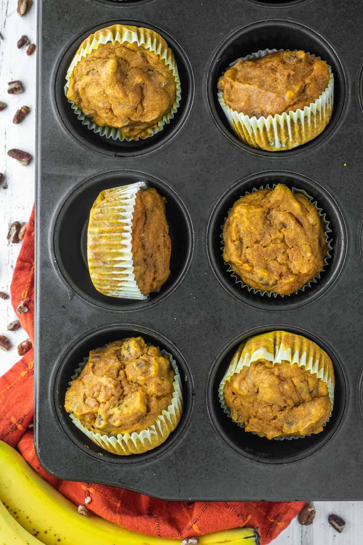 overhead shot of pumpkin banana muffins in muffin tin