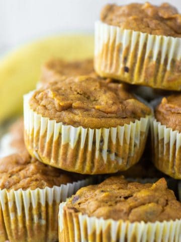 stacked muffins made with pumpkin and bananas