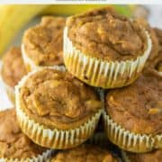 stacked pumpkin banana muffins with bananas in the background
