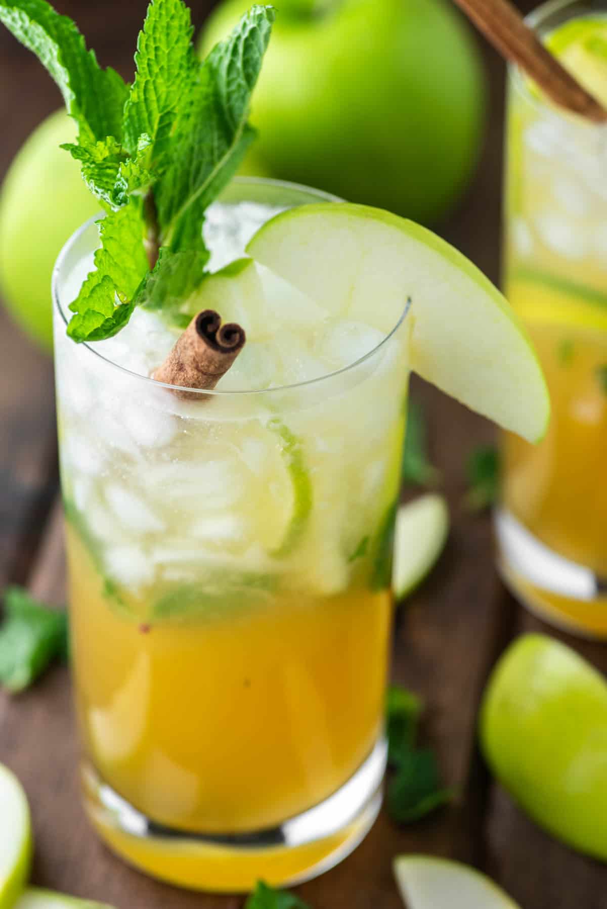 glass of apple mojito with apple, mint and lime