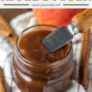 knife dipped in jar of apple butter