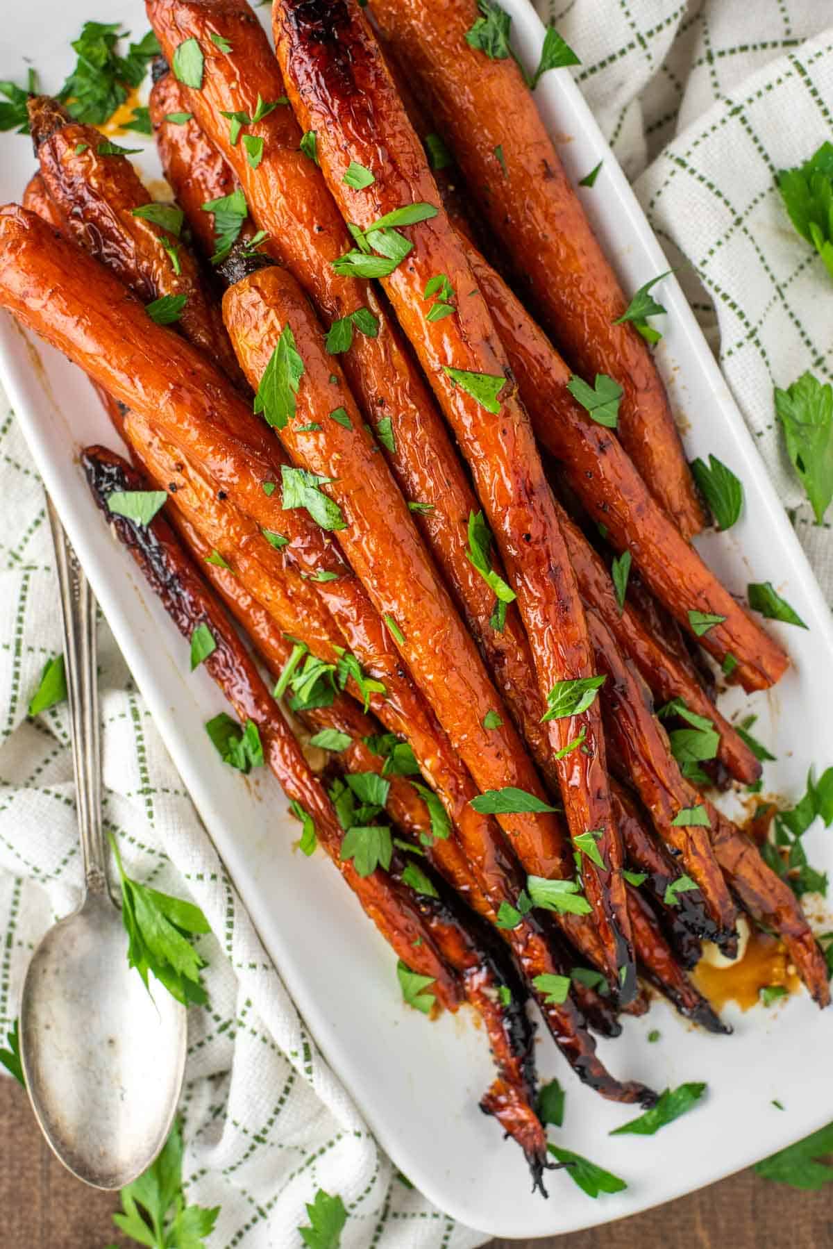 overhead shot of maple roasted carrots on white plate