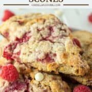raspberry and white chocolate scones stacked on top of plate