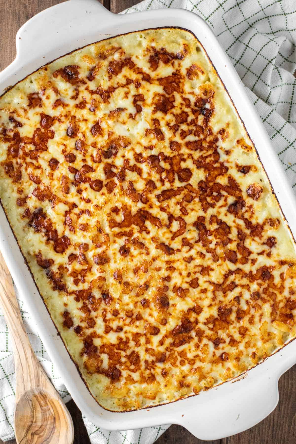overhead shot of white cheddar mac and cheese in white baking dish