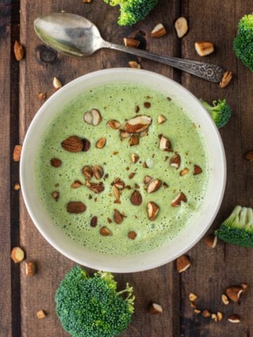 overhead shot of broccoli almond soup in bowl