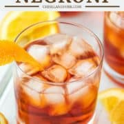 glass of Aperol negroni with ice and orange peel