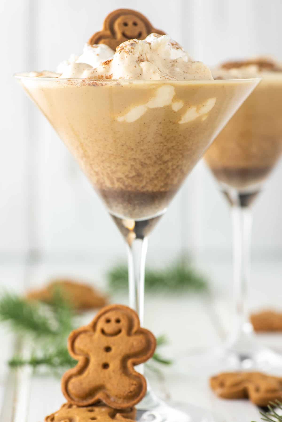 two glasses of gingerbread martinis with whipped cream