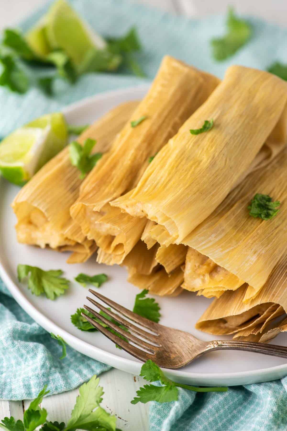 stacked tamales made with Instant Pot on white plate