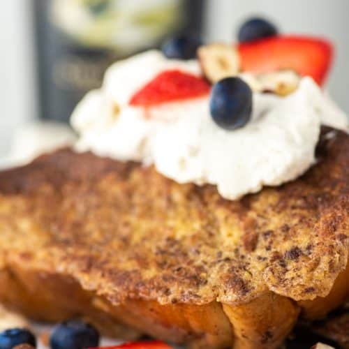 French toast with Baileys whipped cream on white plate