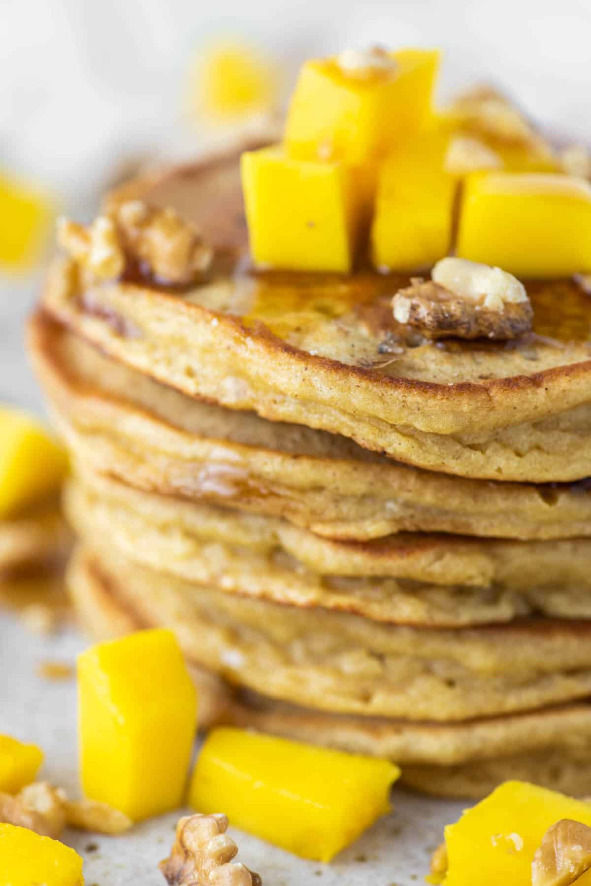 close-up of stacked mango pancakes on plate