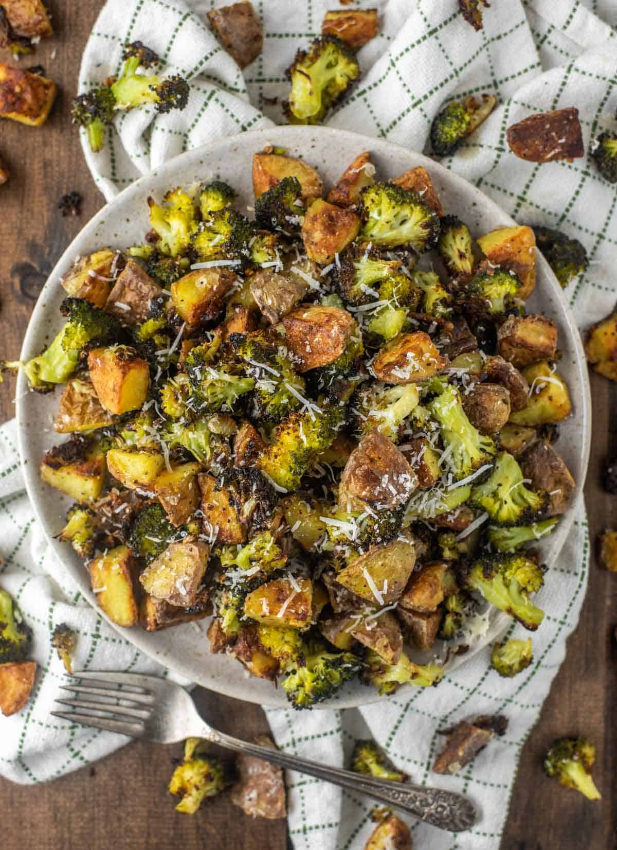 overhead shot of roasted potatoes and broccoli on plate