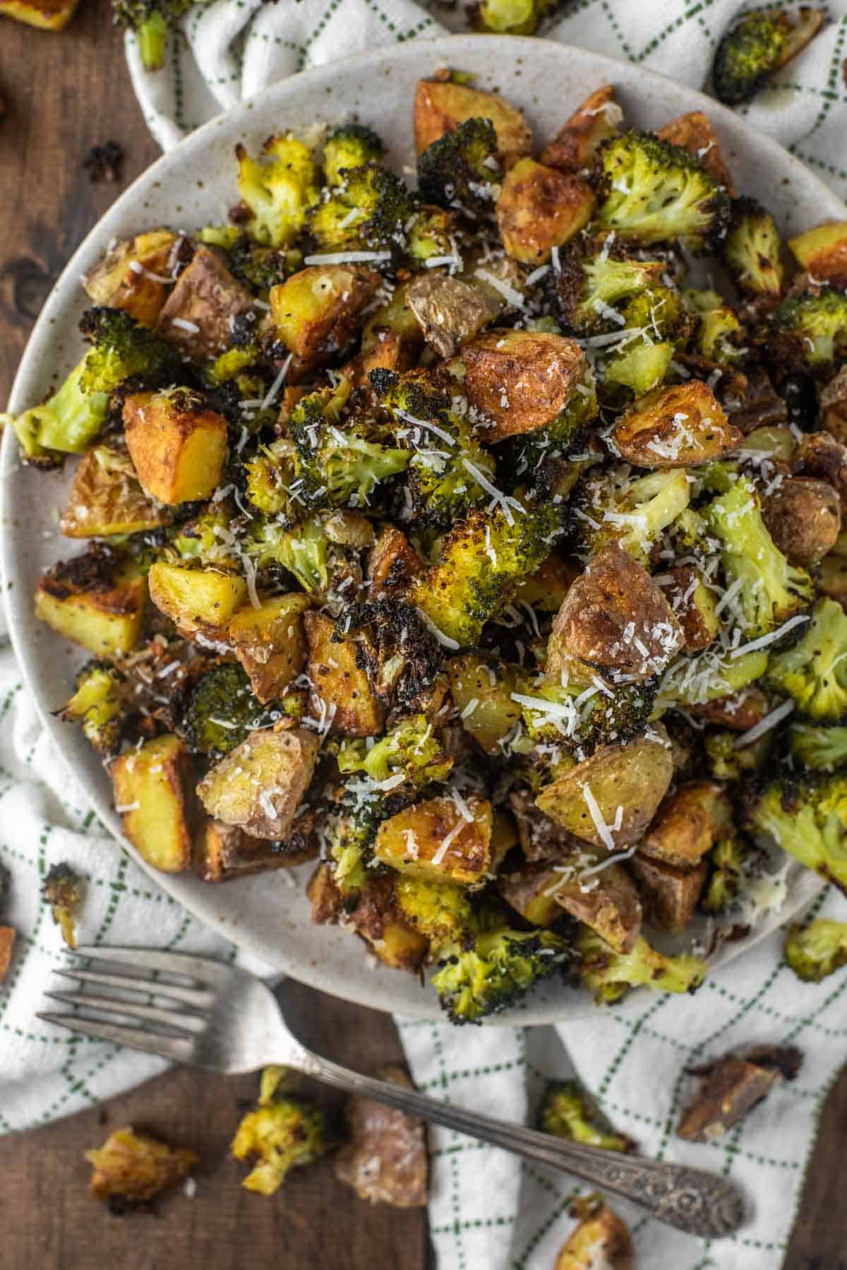 overhead shot of roasted broccoli and potatoes on plate