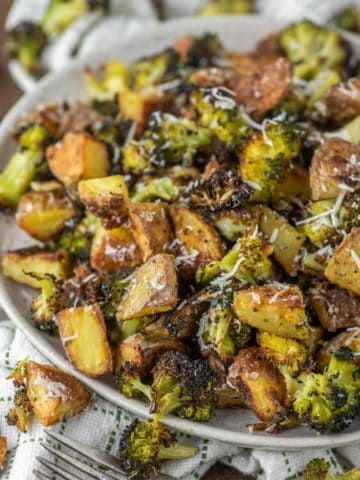close-up of roasted potatoes and broccoli on plate