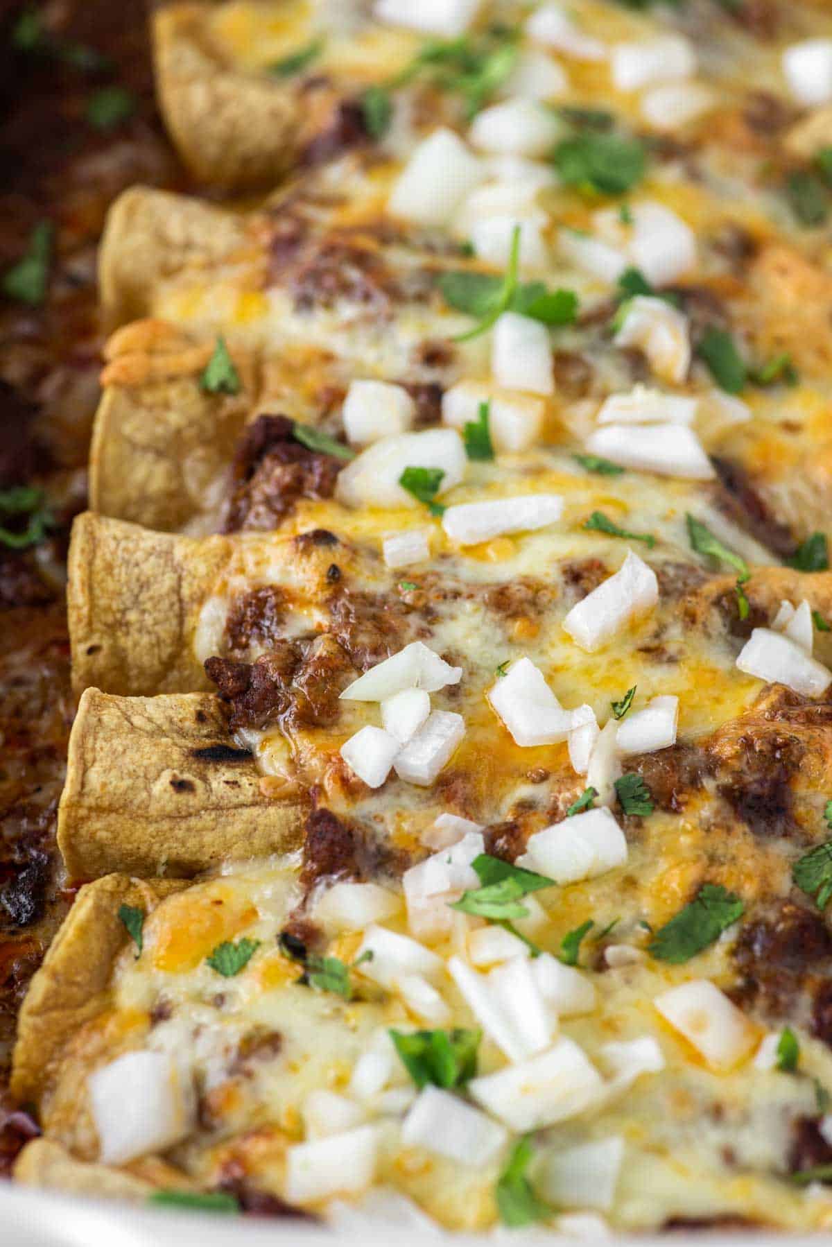 close-up of carne enchiladas in a white baking dish