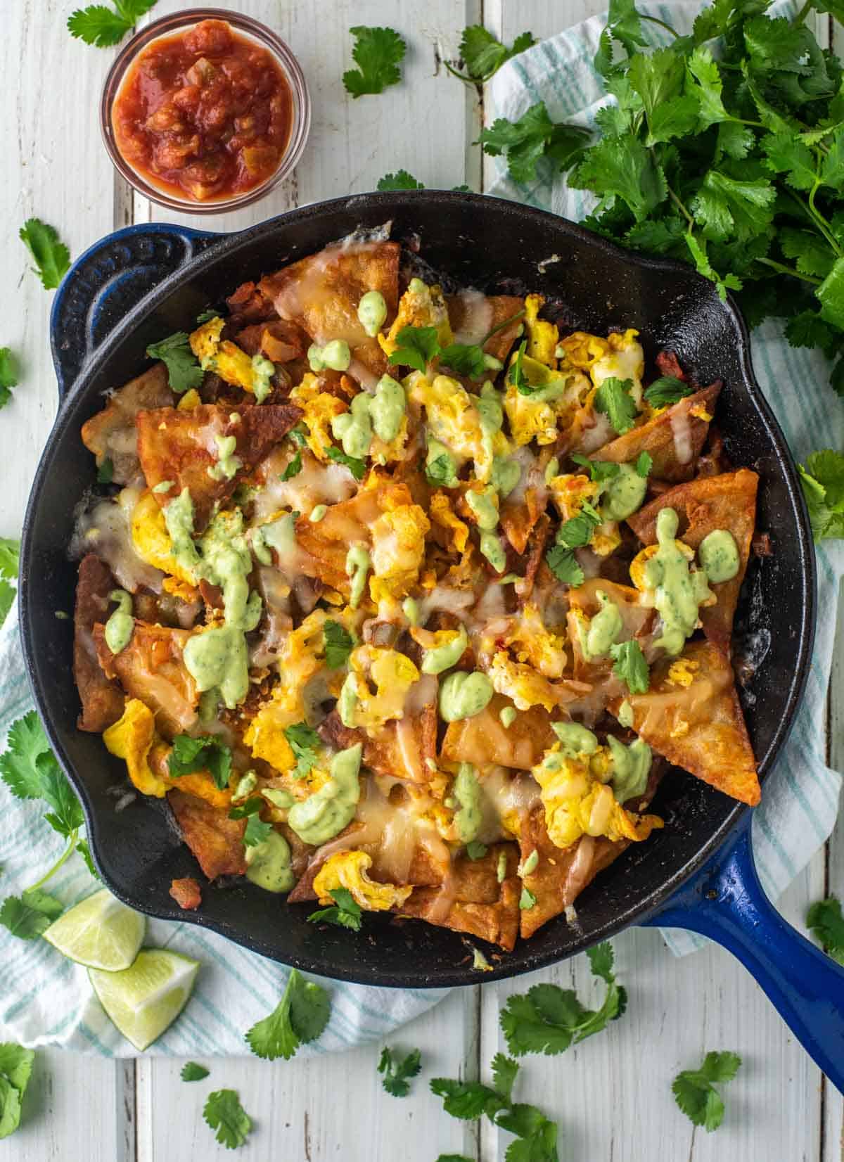 overhead shot of chilaquiles con huevos in cast iron skillet