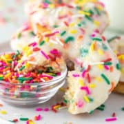 funfetti donut dipped in bowl of sprinkles